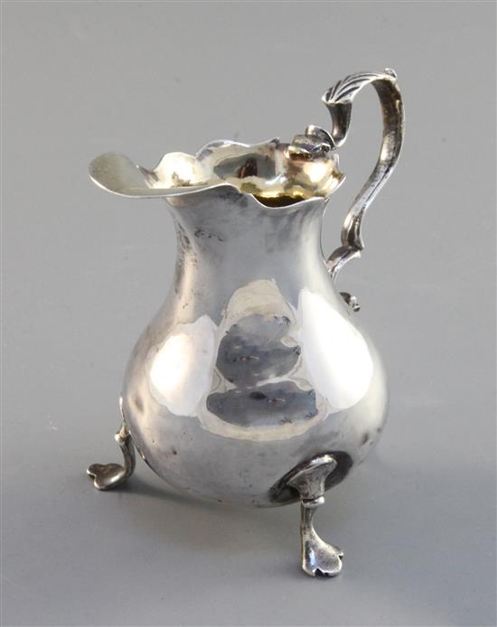 A George III silver helmet cream jug,